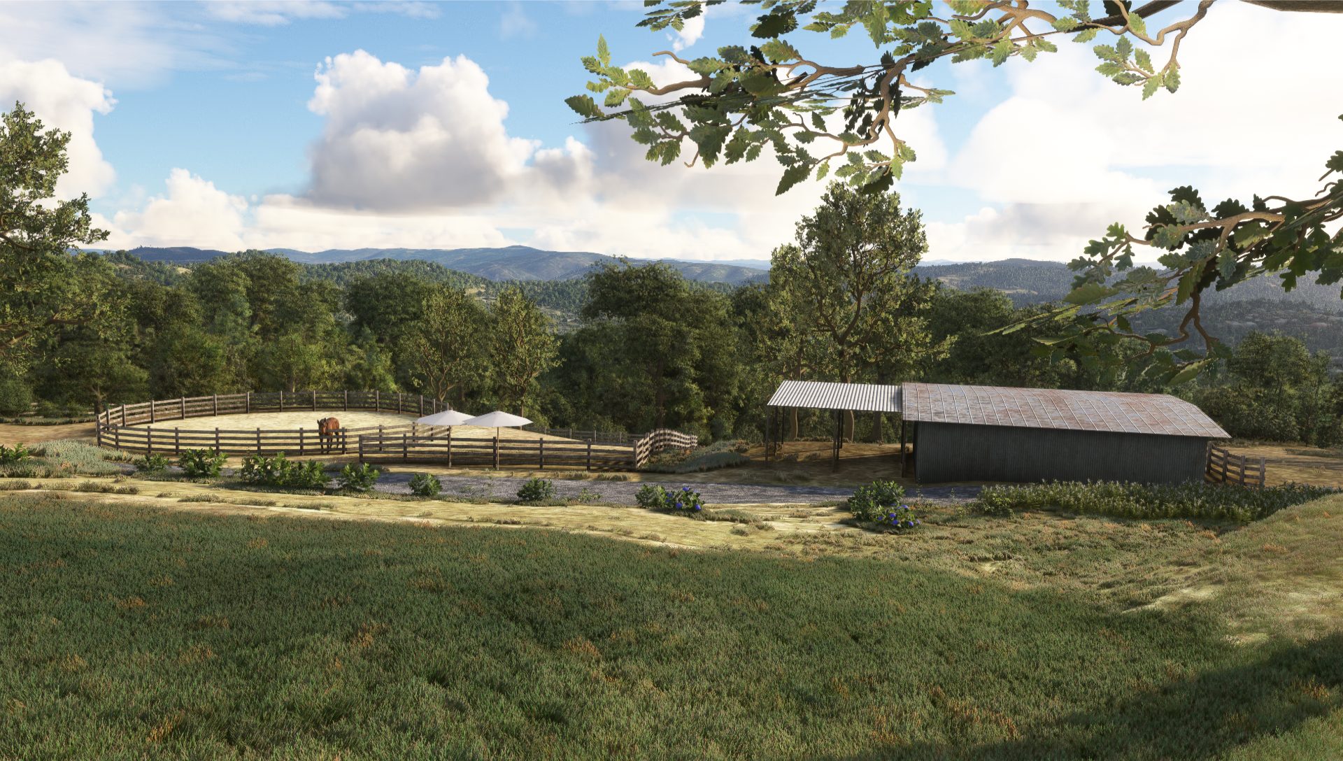 Overlooking a barn and stable from a grassy hill
