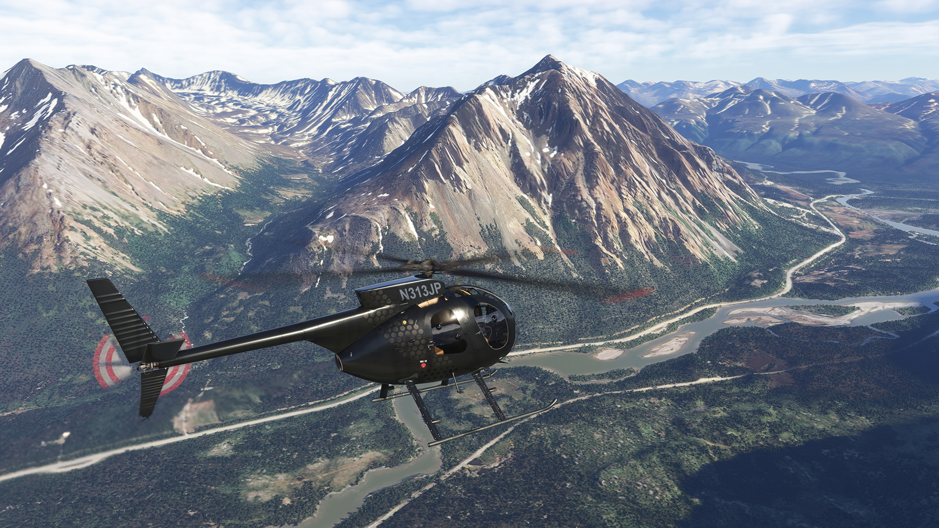 Taog's 500 helicopter in the mountains of Alaska